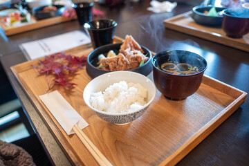Lake Kawaguchi, Fujikawaguchiko, Minamitsuru District, Yamanashi, Japan, Japanese meal with rice, fried chicken, and miso soup on wooden tray