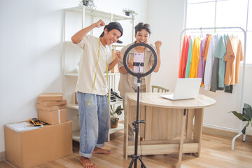 Young Entrepreneurs Celebrating Business Success With Live Stream