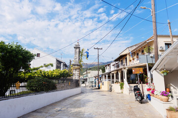 Main street view of a traditional town square in Kassiopi, Corfu, Greece