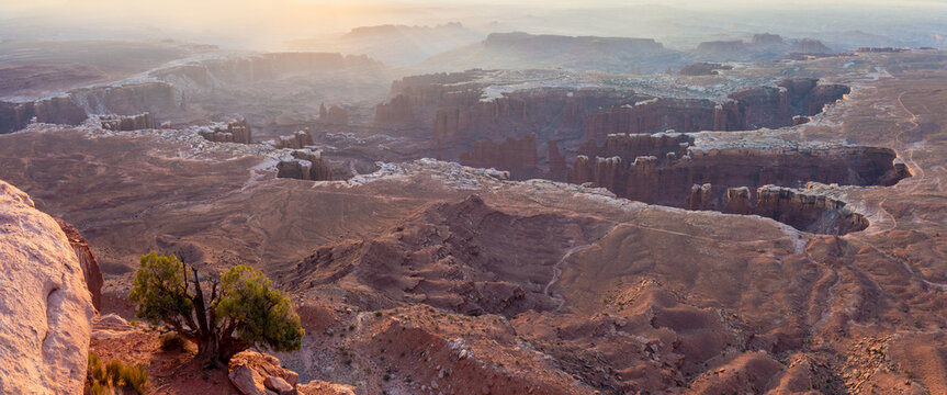 Mesa Arch is a pothole arch on the eastern edge of the Island in the Sky mesa in Canyonlands National Park, San Juan County, Utah, United States. Sunrise in summer time. Popular destination.