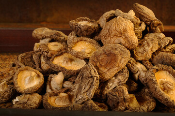 dried shiitake mushrooms on wooden background
