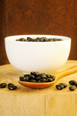 raw black beans in spoon