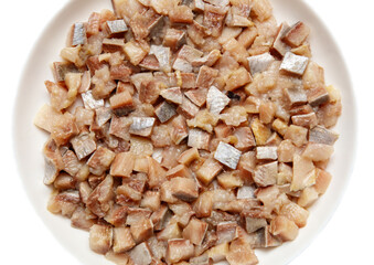 A plate of fish is cut into small pieces