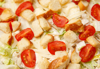 A salad with bread crumbs, tomatoes, and cheese