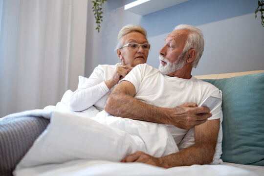 Senior couple in bedroom