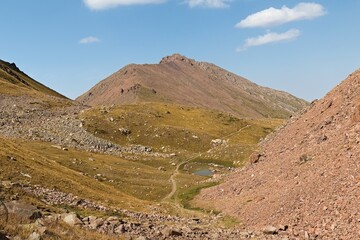 View from Talgar Pass to Shymbulak mountain 3,450 meters high in Tian Shan mountain range near Almaty city. Kazakhstan. Asia. 