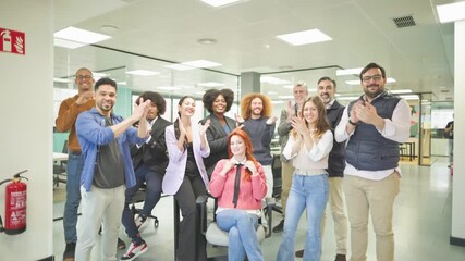 Startup business team clapping celebrating success in office - Powered by Adobe