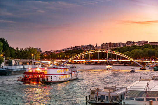 Paris France boats float on Seine under Passerelle Debilly bridge