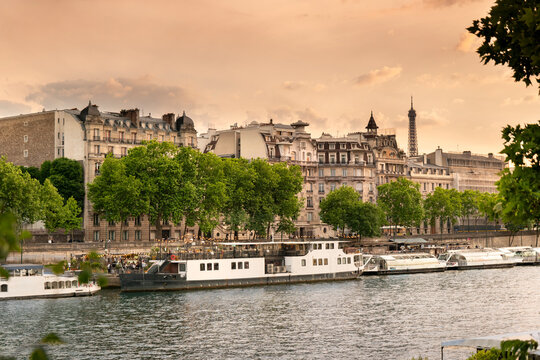 Paris France boat docked along Seine River near classical Left Bank