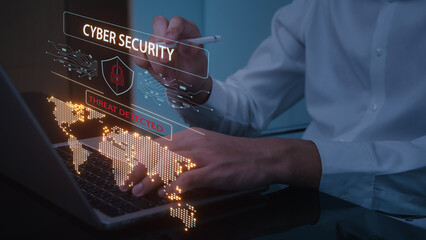 Focused man analyzes network traffic for cyber security intrusion on futuristic digital interface with world map