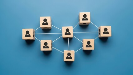 Network of people represented by wooden cubes with human icon on blue background