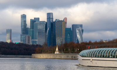 Moscow-City modern skyline with river and autumn foliage