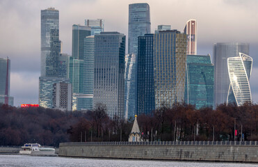 Moscow-City modern skyline with river and autumn foliage