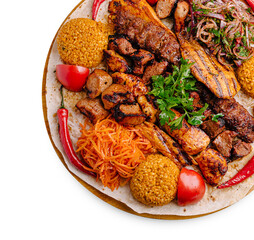 Grilled meat platter with colorful sides served on a round wooden tray