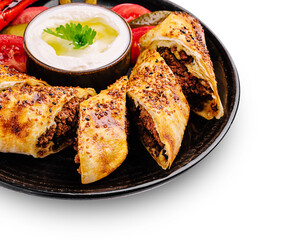 Delicious savory rolls served with fresh vegetables and yogurt dip