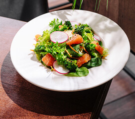 Fresh garden salad with vibrant vegetables served on a rustic table