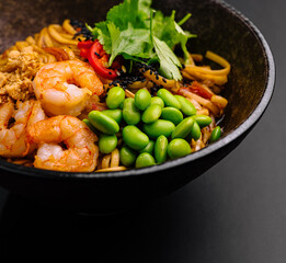 Delicious shrimp and noodle bowl with fresh vegetables