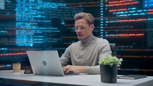 Male Programmer Uses Laptop, Reviewing  Source Code Streams on Panoramic Screens in Office. Software Engineering, Bug Fixing, Software Development, App Design. 360 Degree Tracking Arc Shot