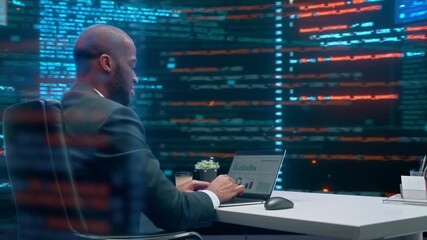 Black Male Software Engineer in Office Analyzes Code, Monitors Data, Manages Cybersecurity Operations on His Laptop, Surrounded by Programming Screens, Digital Analytics. 360 Degree Tracking Arc Shot - Powered by Adobe