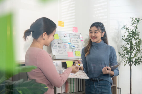 UX UI Designers Sharing Ideas in Bright Office - Powered by Adobe