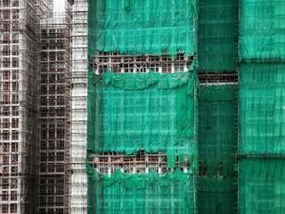 Bamboo scaffolding with building under construction with scaffolding, Hongkong Construction Safety,...