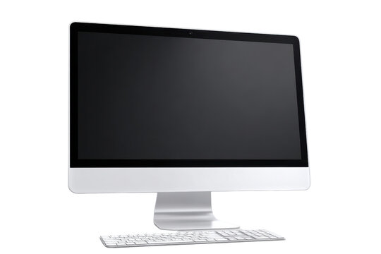 Silver all in one computer with white keyboard on black background technology desktop