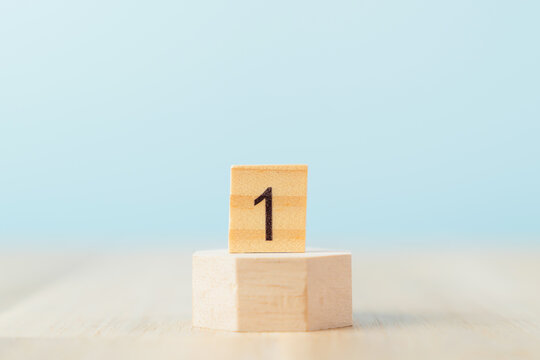 Ranking and achievement symbolized concept, Number 1 on wood block