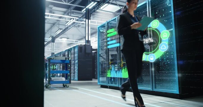 IT Engineer Walks Through Data Center, Monitoring Holographic Dashboards on Server Racks, Visualizing Digitization Progress, Cloud Workload, Network Health, Infrastructure Analytics 
