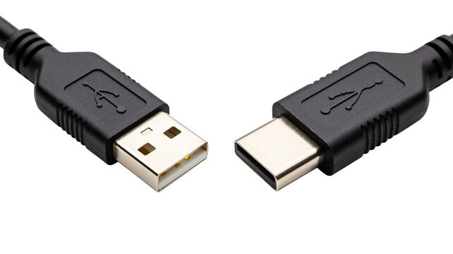 Close up shot of usb type a and type c cables positioned facing each other on black