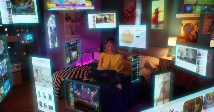 Young Black Woman Shops Online From Bed at Night, Browsing Holographic Product on Laptop. Purchase Gadgets, Fashion, Accessories While Enjoying Digital Retail, Personalized Ecommerce Recommendations