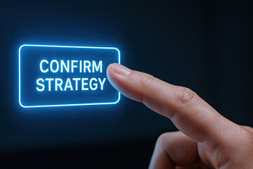 Confirm strategy button glowing in neon blue with fingertip about to press it, business decision concept and modern technology interaction