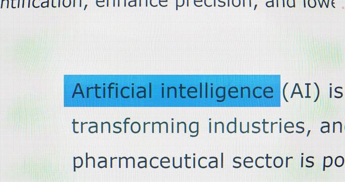 Macro Screen Capture Glides Across Text, Repeatedly Highlighting the Phrase &ldquo;artificial Intelligence&rdquo; in Bright Blue. Visualizing Ai Keyword Detection, Document Analysis, Explainers and Education