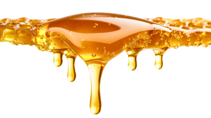 Golden honey dripping viscous liquid isolated on a transparent background amber