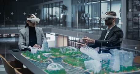 Architect and Engineer in VR Headsets Design a Futuristic City, Manipulating Holographic Skyscrapers, Eco Districts on a Smart Table, Immersive Virtual Reality, Urban Planning, Digital Twin Simulation - Powered by Adobe