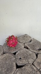 Vibrant Dragon Fruit on Rustic Wooden Log Table