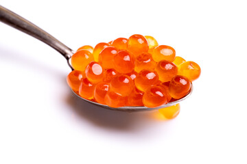 Red caviar. Salmon fish roe in a silver spoon isolated on white background. Closeup of red caviar....