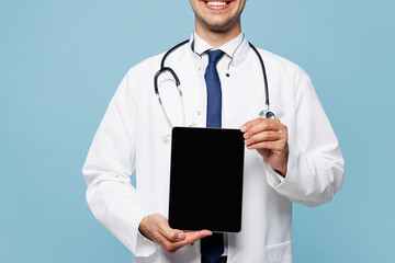 Close up young male doctor man wear white medical gown suit work in hospital clinic office hold...