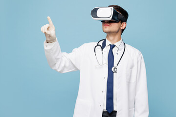 Young male doctor man he wears white medical gown suit work in hospital clinic office watching in...