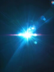 Obraz premium Bright blue light burst, dark bokeh background