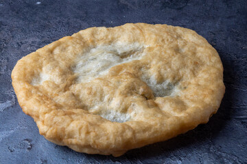 Hungarian traditional fast food - deep fried flatbread - lángos