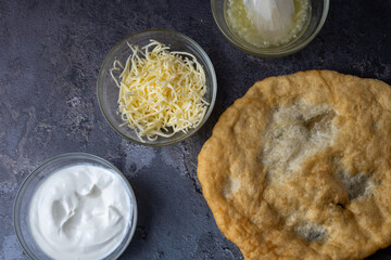 Hungarian traditional fast food - deep fried flatbread - lángos