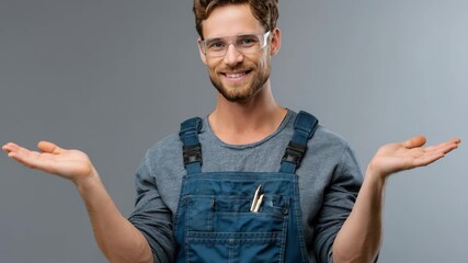 Confident professional handyman poses with a smile in casual work attire, showcasing tools and skills in a well-lit indoor space