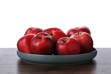 Ripe red apples on wooden table against white background, closeup