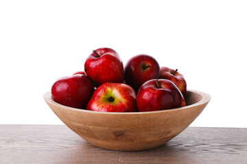Ripe red apples in bowl on wooden table against white background, closeup