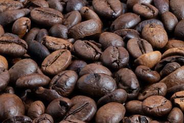 Artisan coffee beans displaying natural textures and earthy tones, Closeup image showcasing handcrafted coffee beans highlighting origin and sustainable farming practices