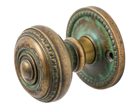 Antique brass doorknob with verdigris patina on black background isolated on a transparent background