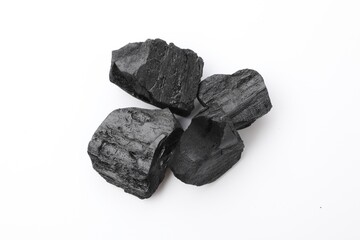 Obraz premium Pieces of black coal isolated on white, top view