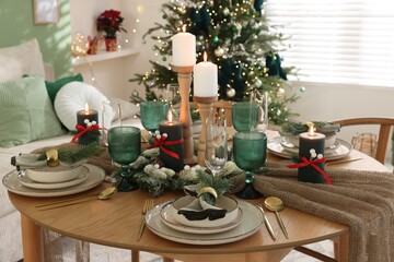 Festive table setting with Christmas decor indoors, closeup