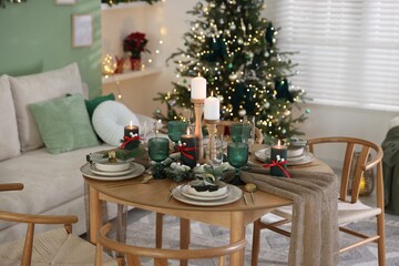 Festive table setting with Christmas decor indoors
