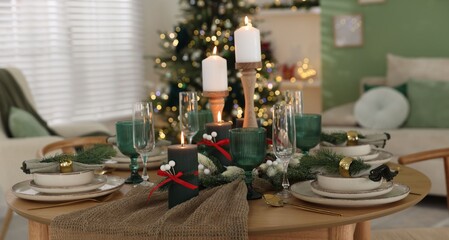 Festive table setting with Christmas decor indoors, closeup